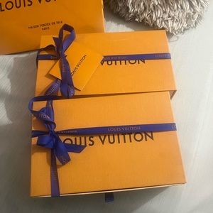 Two Louis Vuitton wallet boxes and mini shopping bag